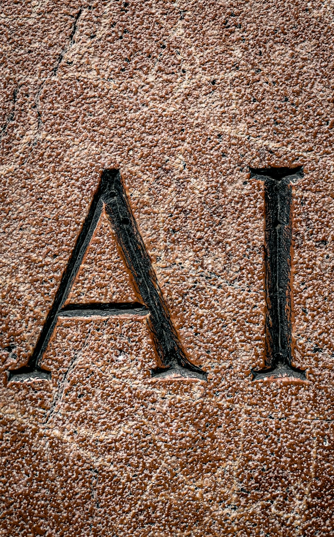 services-03 the-letters-ai-are-carved-into-a-stone-kpmvidukf-4